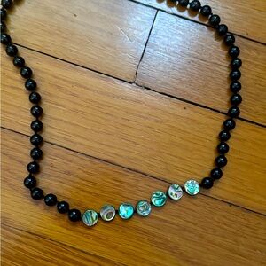 knotted on silk, black onyx and mother of pearl beads, sterling silver clasp